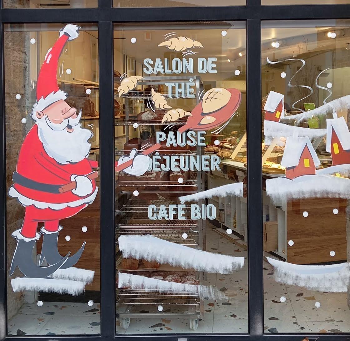 Père Noël enfournant du pain, lettrage « Salon de thé – Pause déjeuner – Café bio » et croissants volants